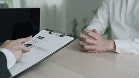 Executives review information on resume to match the job position. Manager ch Video stock 164388985