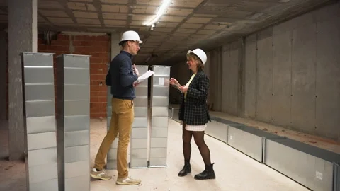 Executives reviewing large commercial development project on construction s.. Stock Footage 329644524