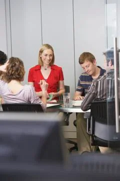 Executives Sitting At Conference Table Stock Photos