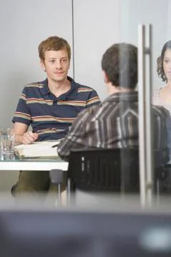 Executives Sitting At Conference Table Stock Photos
