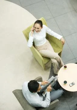 Executives sitting in lobby, high angle view Foto stock