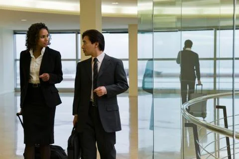 Executives walking and talking Stock Photos