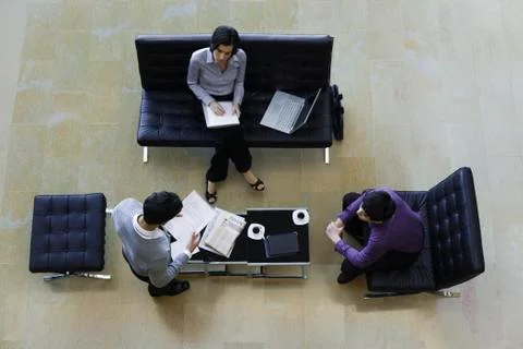 Executives working together, overhead view Stock Photos