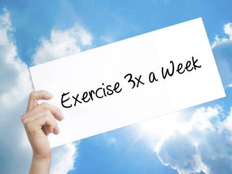 Exercise 3x a Week Sign on white paper. Man Hand Holding Paper with text. ... Stock-Fotos