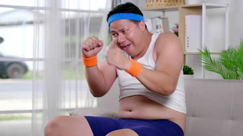 Exercise air boxing training at home. Fat man sportwear showing a big belly Video stock 153069271