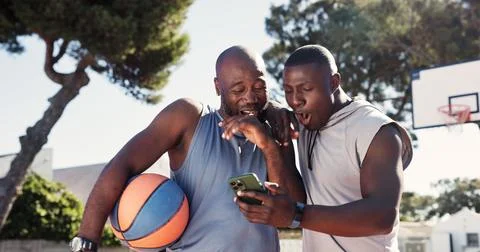 Exercise, app and phone with black people on basketball court for message Stock Photos