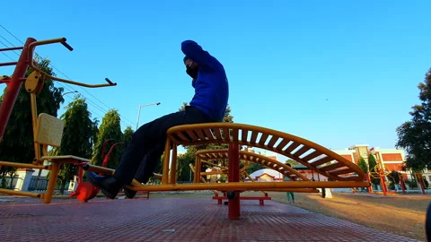 Exercise bally man masked at open air Jim during covid-19 in family quarters  Stock Footage 144568166