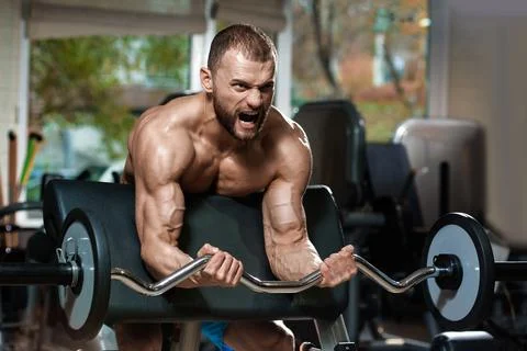 Exercise for biceps with barbell Foto stock