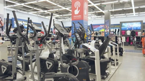 Exercise bikes, walking simulators in a sports store Stock Footage 154616548