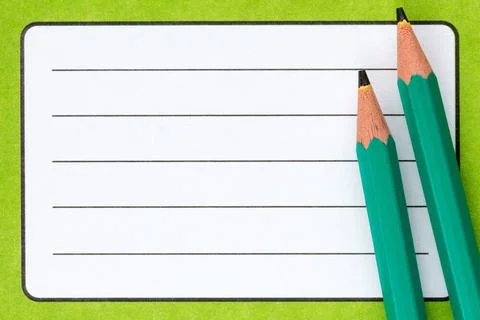 Exercise book name label and pencils Close up of school exercise book, wit... Stock Photos