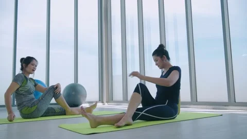 Exercise concept of 4k Resolution. Female athletes stretching in the gym. Stock Footage 144701219