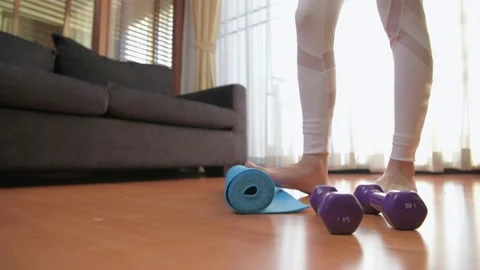 Exercise concept of 4k Resolution. Woman preparing to practice yoga in the li Stock Footage 154118896