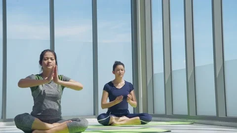 Exercise concept. Athletes doing yoga in the gym. 4k Resolution. Video stock 139641596