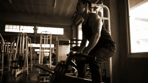 Exercise concept. The young man's shadow is lifting the weight in the gym. Stock Footage 112218787