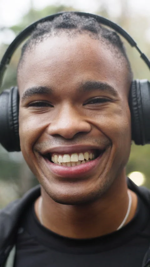 Exercise, face and black man with headphones in rain for fitness dedication, Stock Footage 336711930