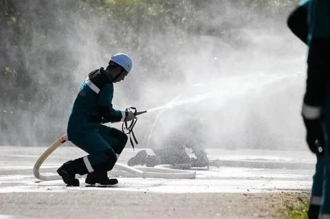 Exercise for fighting fire, hitting the target with a jet of wat Stock Photos