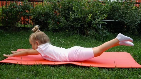 Exercise on a garden mat Stock Footage 115633832