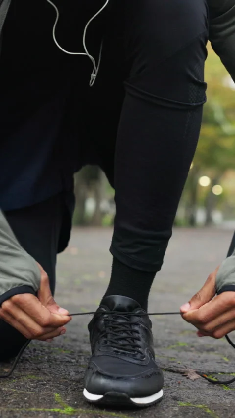 Exercise, hands and athlete tie shoes at park to start fitness, cardio Stock Footage 336784166