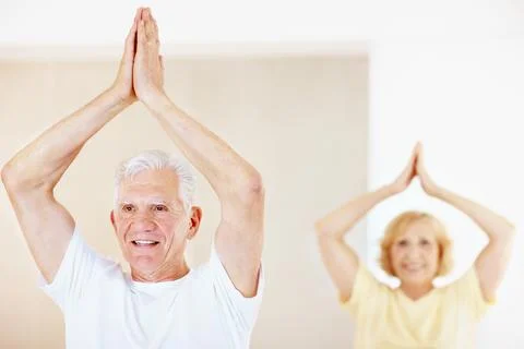 Exercise, hands together and thinking with old man in pilates studio for ac.. Stock Photos