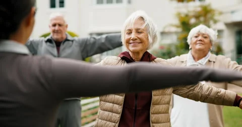 Exercise, instructor and senior people outdoor for wellness, active and muscle Stock Footage 341097606
