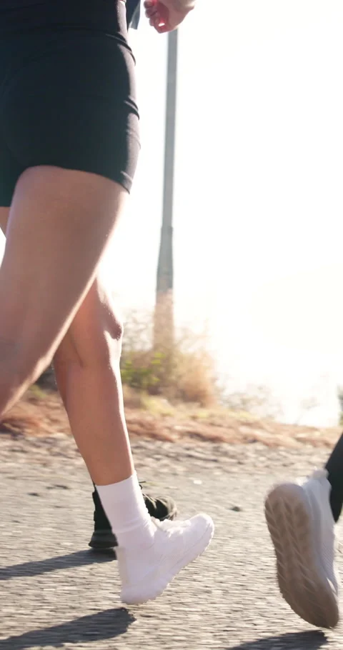 Exercise, legs and running with people outdoor on road together for marathon or Stock Footage 337453824