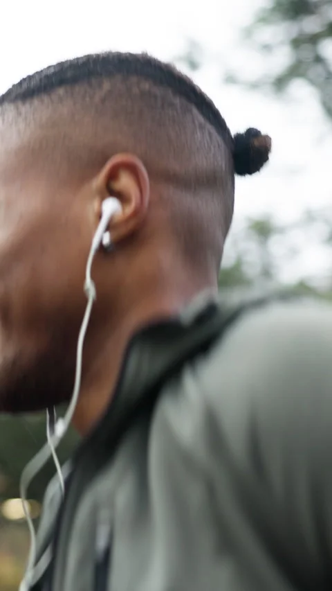Exercise, man or running with earphones in rain for fitness dedication, pace Stock Footage 336707588