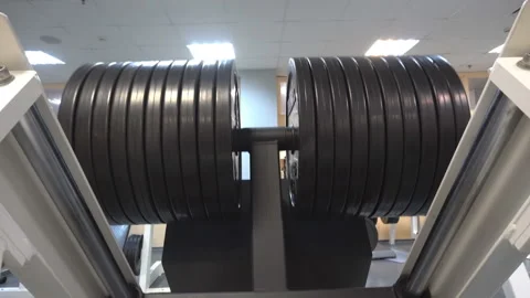 Exercise with maximum weight on the simulator Stock Footage 86134225