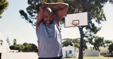 Exercise, park and stretching with black man on basketball court for game Stock Photos