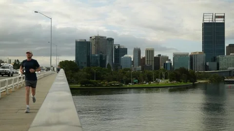 Exercise in Perth next to Swan River 6K Stock Footage 311573296