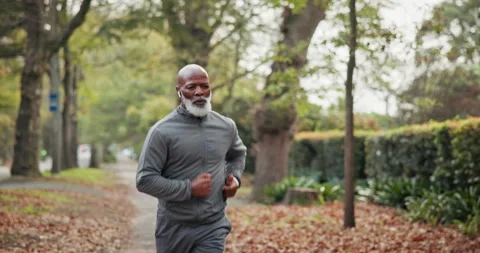 Exercise, running and man with earphones at park for health workout, morning Stock Footage 340884056
