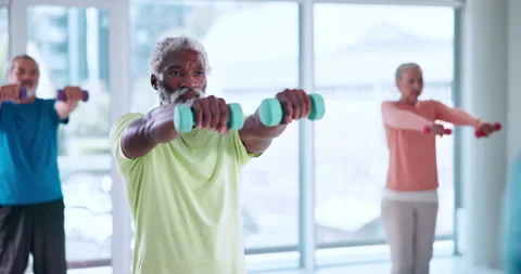 Exercise, senior man and dumbbells in class for retirement fitness, functional Stock Footage 327704597