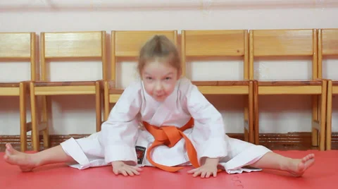 Exercise stretching is doing  a little athlete in a kimono Stock Footage 33994773