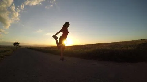 Exercise at sunset. Stock Photos