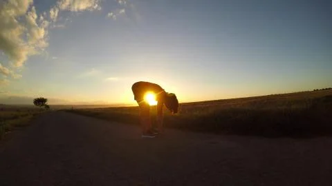Exercise at sunset. Stock Photos