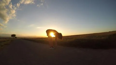 Exercise at sunset.. Stock Photos