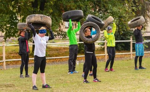 Exercise with the tire. Stock Photos