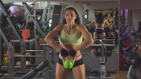 Exercise with weights. Lifting weights to his chest Stock Footage 70359301
