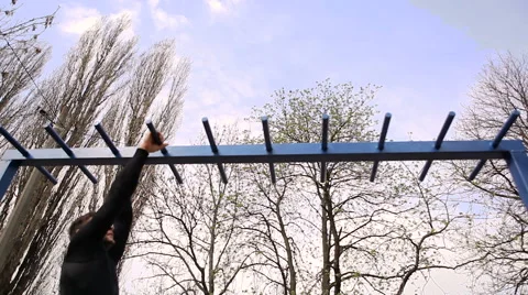 Exercise of a Young Athlete on the Horizontal Bars. Stock Footage 62252698