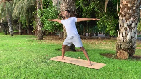 Exercises for better mobility in the morning in summer time on canary islands. Video stock 247452092