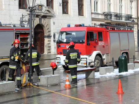 Exercises fire brigade in the old part of the city in the winter. Stock Photos
