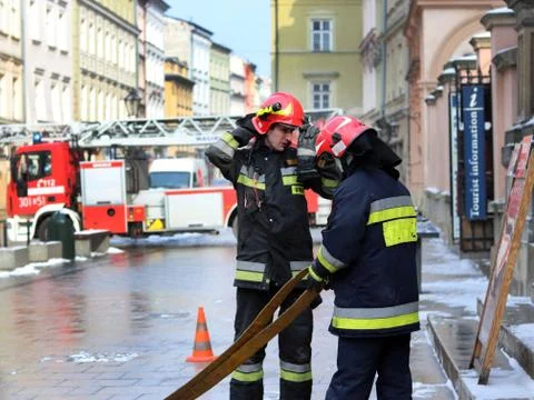 Exercises fire brigade in the old part of the city in the winter. Stock Photos
