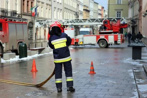 Exercises fire brigade in the old part of the city in the winter. Stock Photos