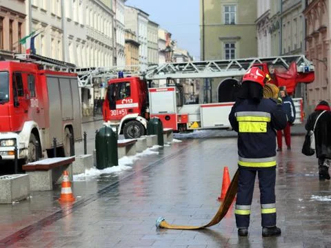 Exercises fire brigade in the old part of the city in the winter. Stock Photos