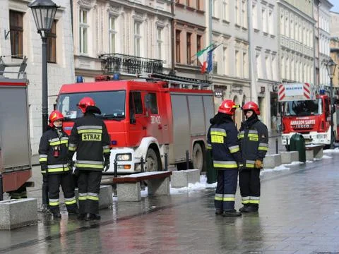 Exercises fire brigade in the old part of the city in the winter. Stock Photos