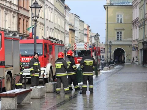Exercises fire brigade in the old part of the city in the winter. Stock Photos
