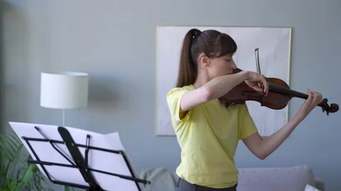 Exercises to Improve her Violin. Practice Time from home. Medium Shot. Stay home Stock Footage 155111275