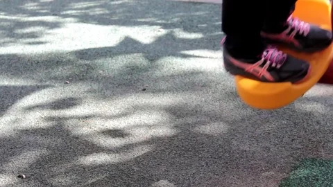 Exercises on an outdoor swing trainer simulator for feet Stock Footage 76247812