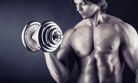 Exercising with dumbbell Stock Photos