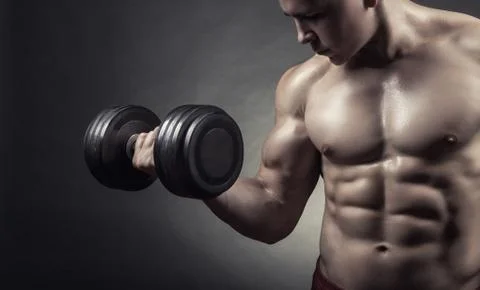 Exercising with dumbbell Stock Photos