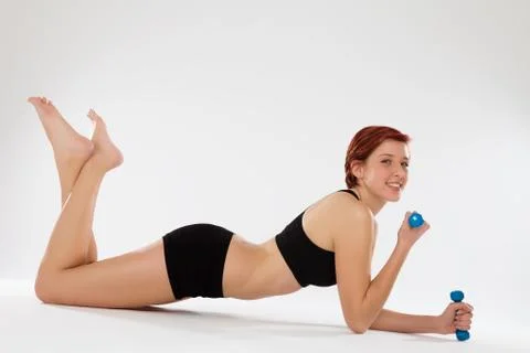 Exercising elbow pushups with dumbbells Stock Photos